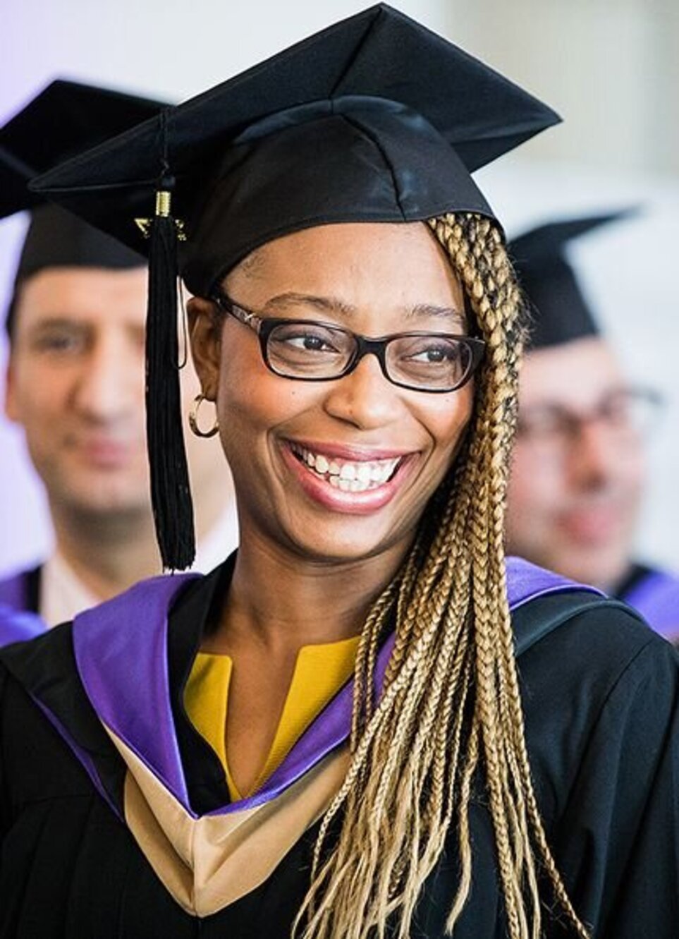 Smiling woman in graduation attire